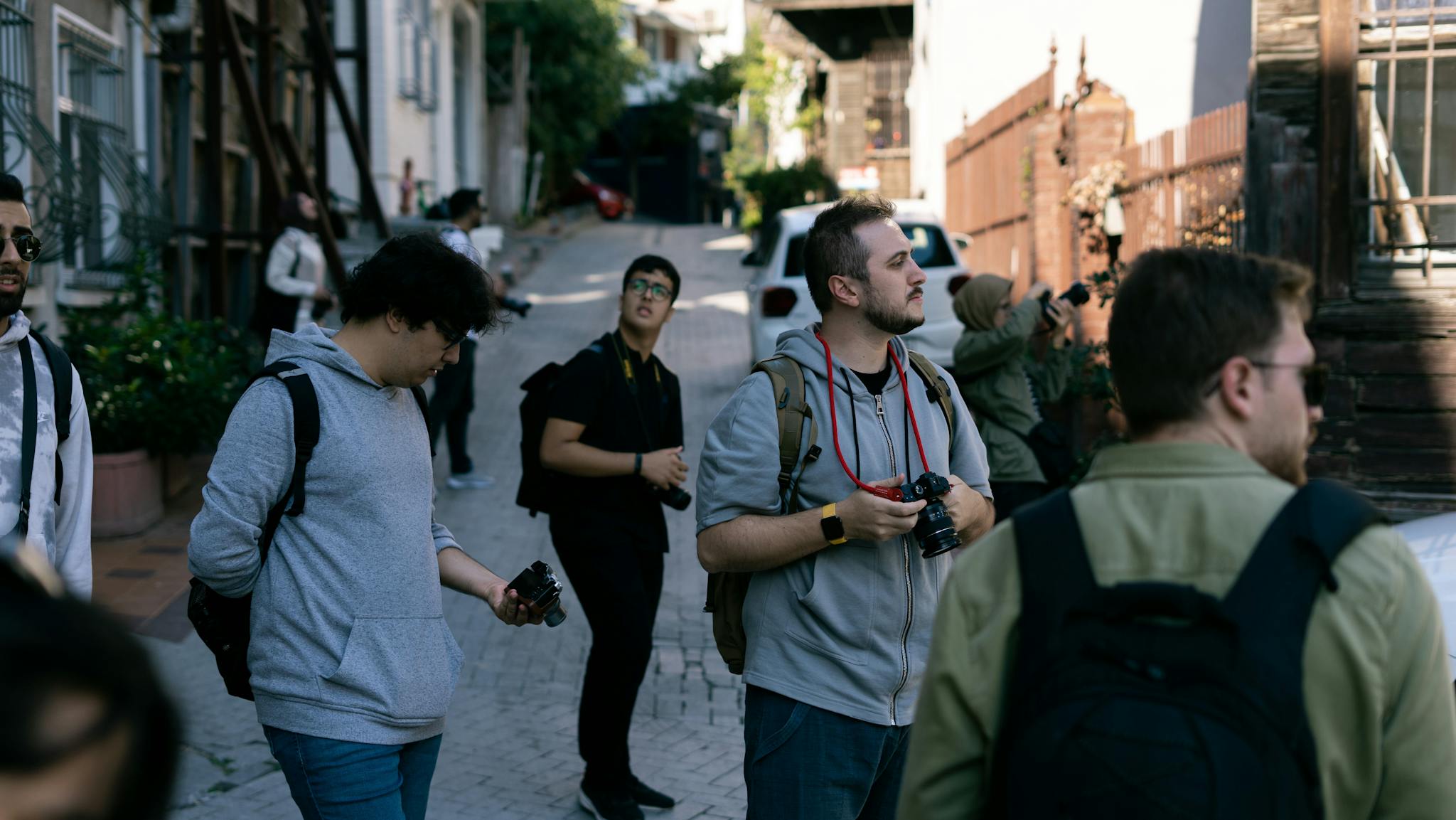Group of photographers capturing the charm of Istanbul streets.